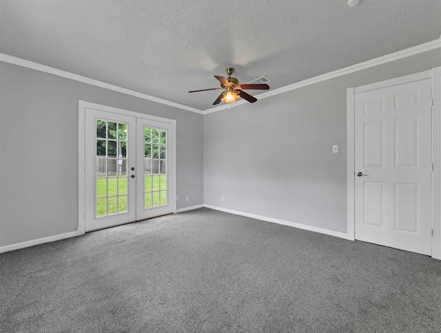 spare room featuring a textured ceiling, carpet flooring, french doors, and ornamental molding