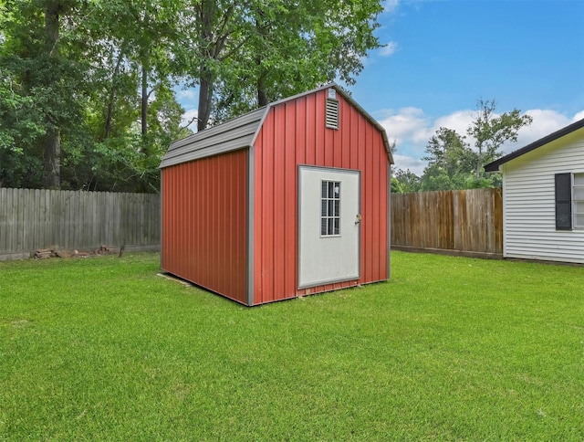 view of shed featuring a fenced backyard