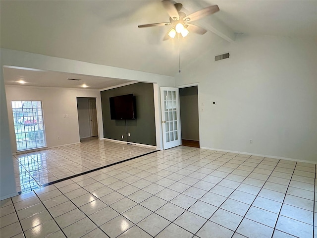 spare room with beamed ceiling, visible vents, a ceiling fan, light tile patterned floors, and baseboards