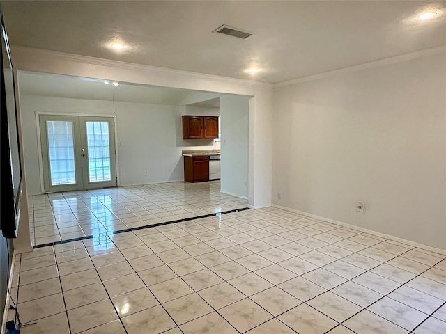 unfurnished room with light tile patterned floors, visible vents, baseboards, french doors, and crown molding