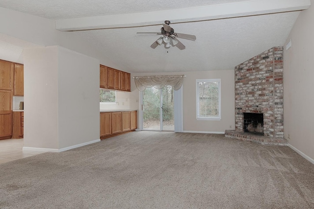 unfurnished living room featuring plenty of natural light, light colored carpet, a brick fireplace, and lofted ceiling with beams