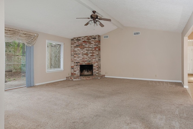 unfurnished living room with lofted ceiling with beams, visible vents, carpet, and a fireplace