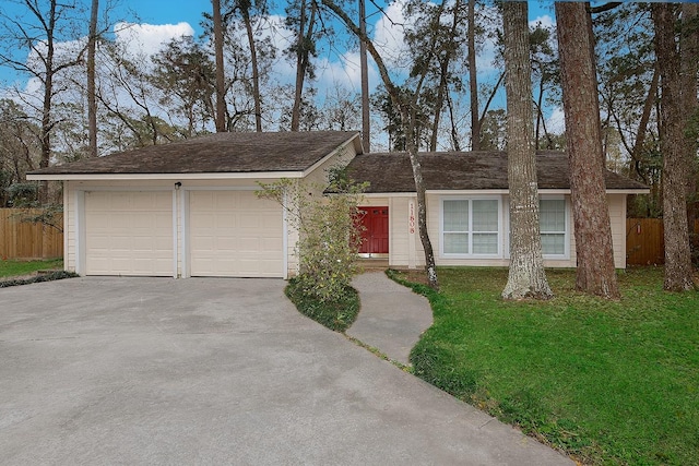 ranch-style house with a front yard and fence