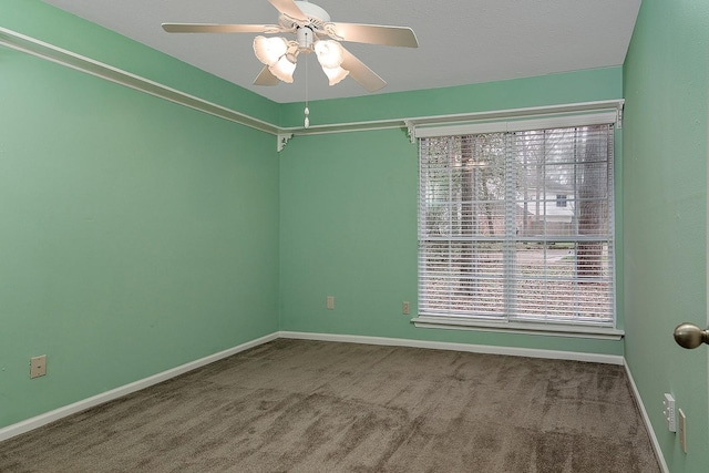 spare room with ceiling fan, baseboards, and carpet floors