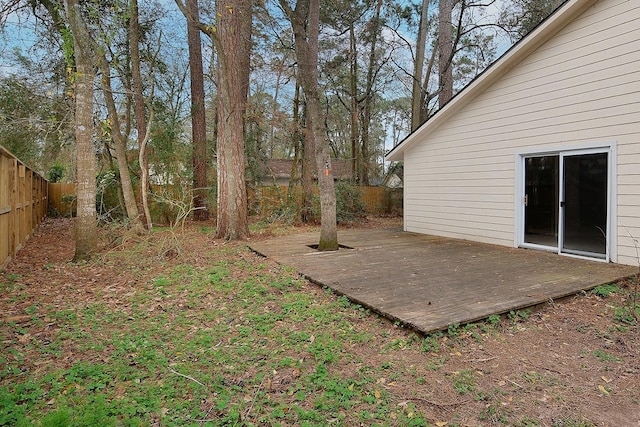 view of yard with a deck and a fenced backyard