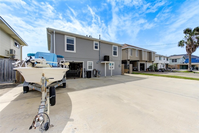 view of front of home featuring fence and a residential view