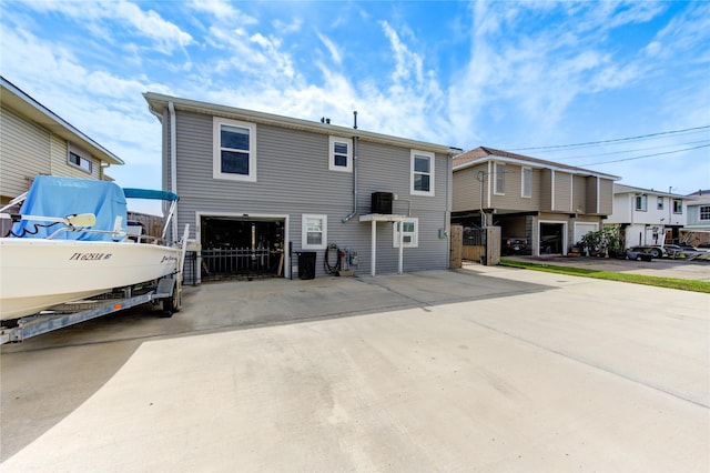 view of front facade featuring a residential view and concrete driveway