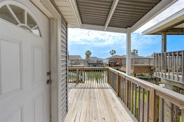 wooden deck with a residential view