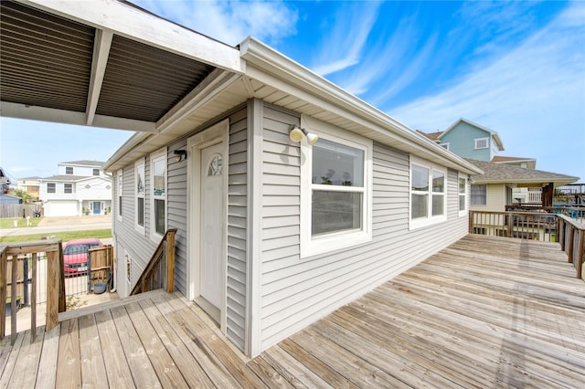 wooden deck with a residential view