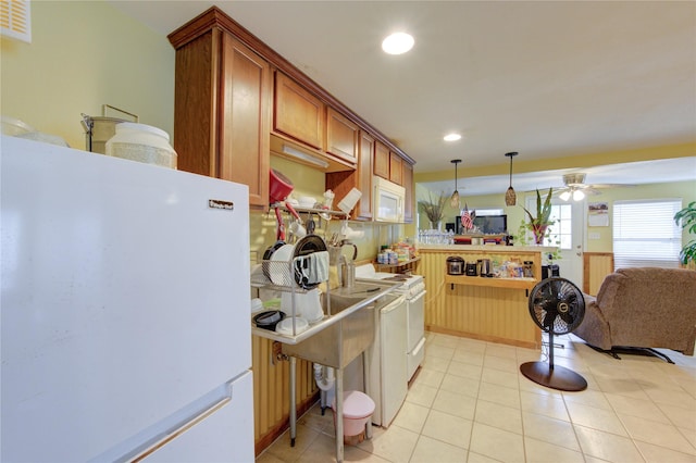 kitchen featuring pendant lighting, recessed lighting, white appliances, light tile patterned floors, and ceiling fan