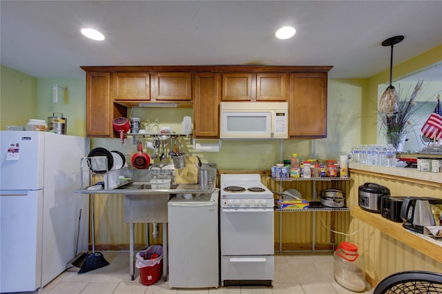 kitchen featuring white appliances, light tile patterned flooring, recessed lighting, and brown cabinets