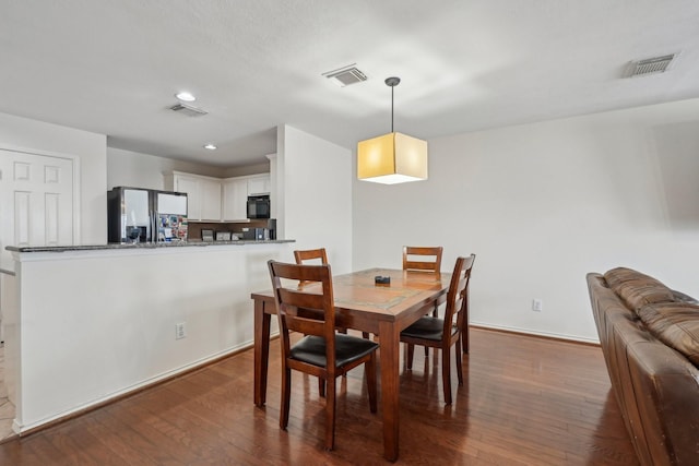 dining space with recessed lighting, visible vents, and dark wood-style floors