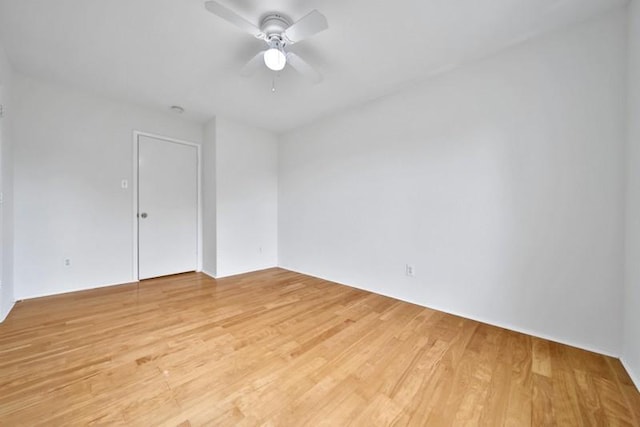 unfurnished room with light wood-style flooring and ceiling fan