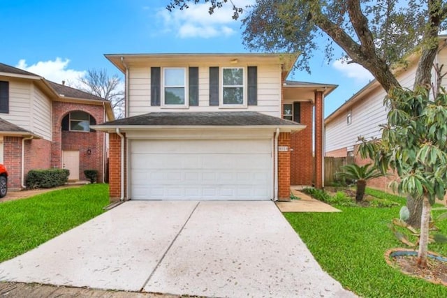 view of front of house with concrete driveway, an attached garage, brick siding, and a front yard