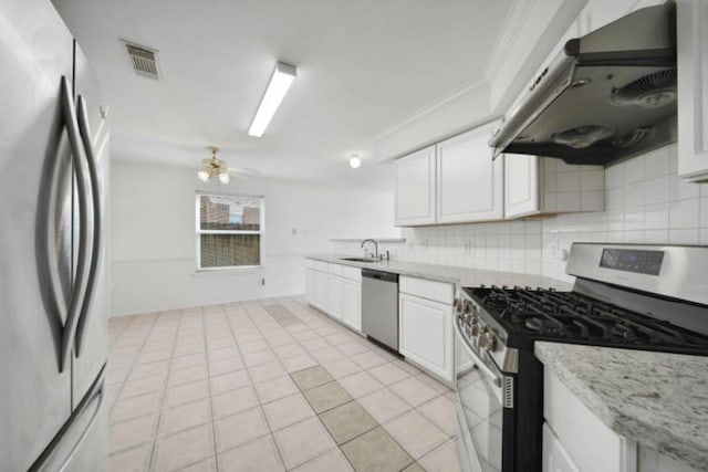 kitchen featuring under cabinet range hood, visible vents, appliances with stainless steel finishes, and tasteful backsplash