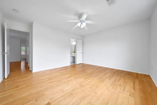 unfurnished room featuring visible vents, ceiling fan, and light wood-style floors