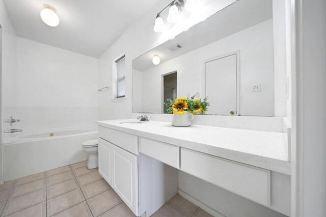 full bathroom with vanity, tile patterned floors, toilet, and a bathtub