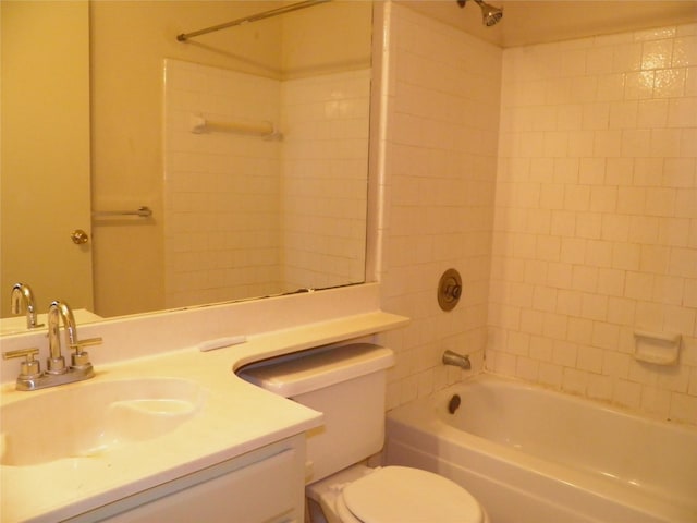 bathroom featuring tub / shower combination, toilet, and vanity