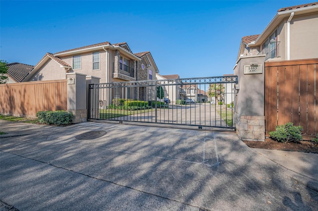 view of gate with a residential view