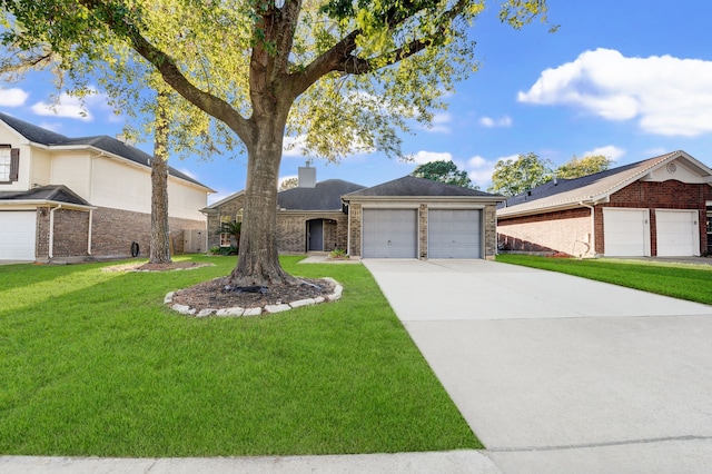 single story home featuring driveway, a front yard, a garage, brick siding, and a chimney