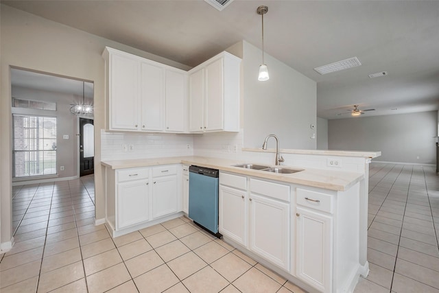 kitchen with dishwashing machine, light tile patterned floors, a peninsula, a sink, and open floor plan