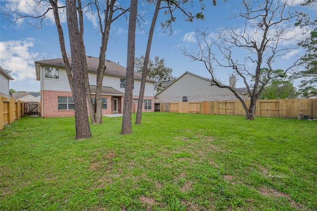 view of yard with a fenced backyard