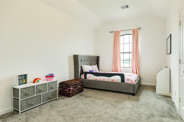 bedroom with vaulted ceiling, baseboards, visible vents, and carpet floors