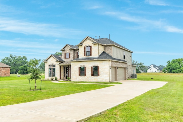 french provincial home featuring cooling unit, roof with shingles, an attached garage, a front lawn, and concrete driveway