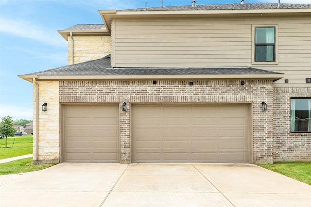 garage with concrete driveway