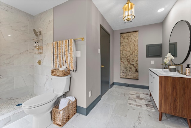 full bath with visible vents, baseboards, toilet, tiled shower, and vanity