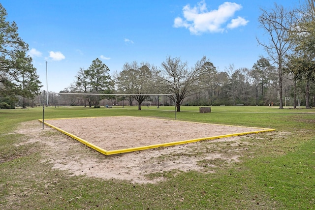 view of home's community featuring a lawn and volleyball court