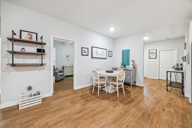 4113 Ella Blvd, Houston, TX 77018 - dining area featuring light wood-style flooring, attic access, and baseboards