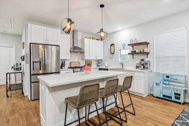 4113 Ella Blvd, Houston, TX 77018 - kitchen with stainless steel fridge with ice dispenser, decorative backsplash, white cabinets, wall chimney exhaust hood, and a sink