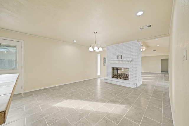 unfurnished living room featuring visible vents, baseboards, recessed lighting, a fireplace, and a notable chandelier