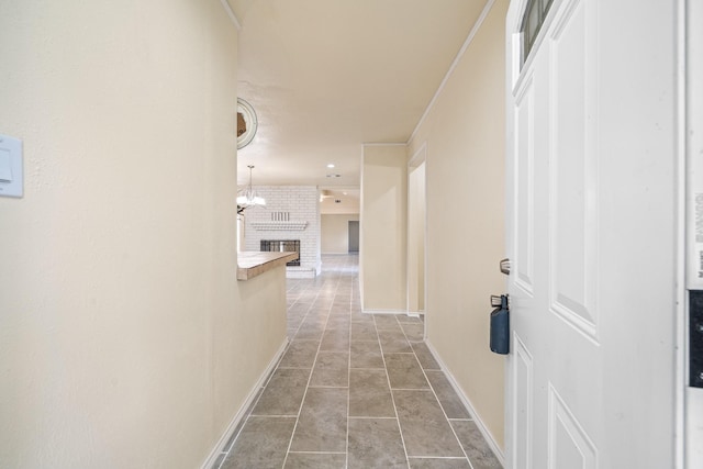 hall with baseboards and light tile patterned flooring