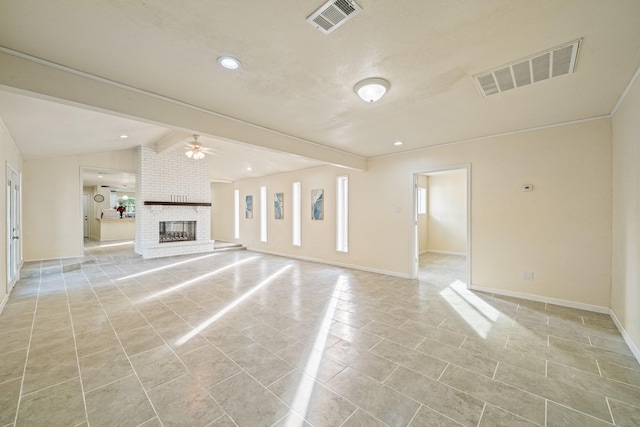 unfurnished living room with visible vents, a fireplace, lofted ceiling with beams, and a ceiling fan