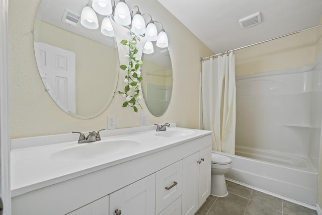 full bathroom with tile patterned floors, visible vents, and a sink