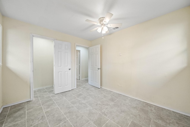 unfurnished bedroom featuring visible vents, baseboards, and ceiling fan