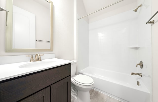 full bath featuring toilet, vanity, bathtub / shower combination, and wood finished floors