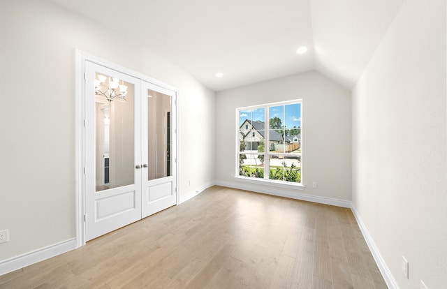 interior space featuring french doors, light wood-type flooring, and baseboards