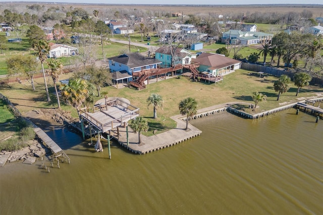 drone / aerial view with a residential view and a water view