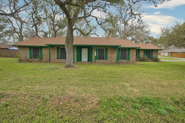 single story home with brick siding and a front yard