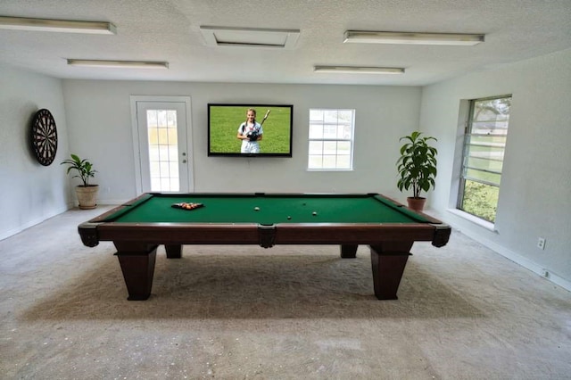 playroom featuring pool table and a textured ceiling