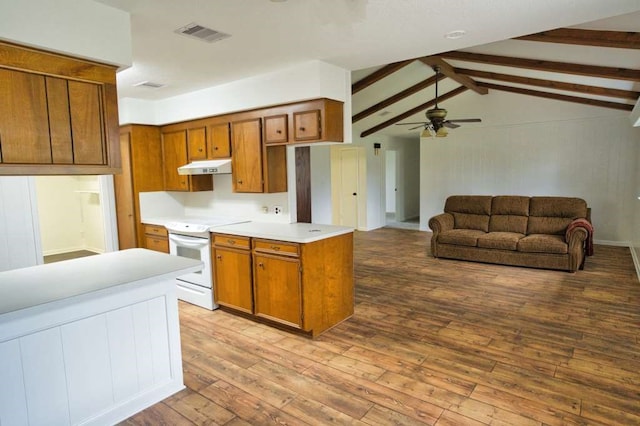 kitchen with brown cabinetry, wood finished floors, light countertops, under cabinet range hood, and white electric range