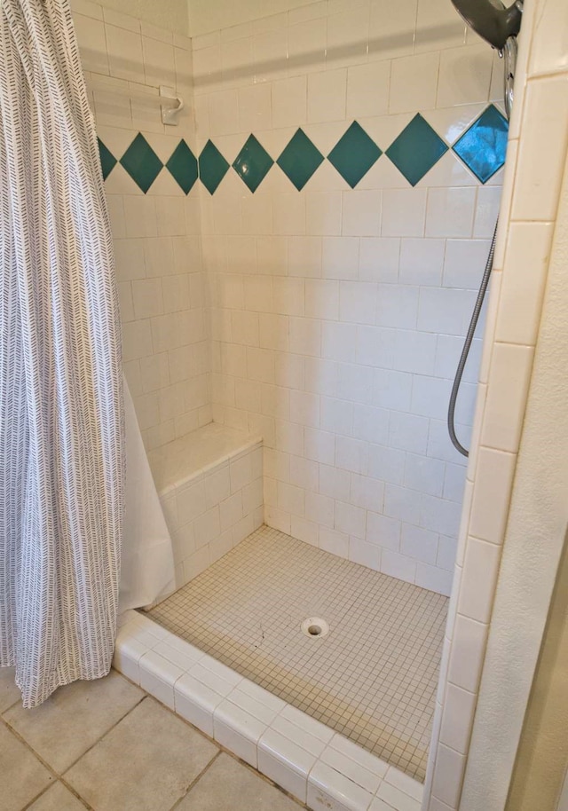 full bath with tile patterned flooring and a stall shower