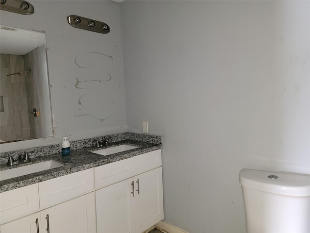 full bathroom with toilet, a shower, visible vents, and a sink