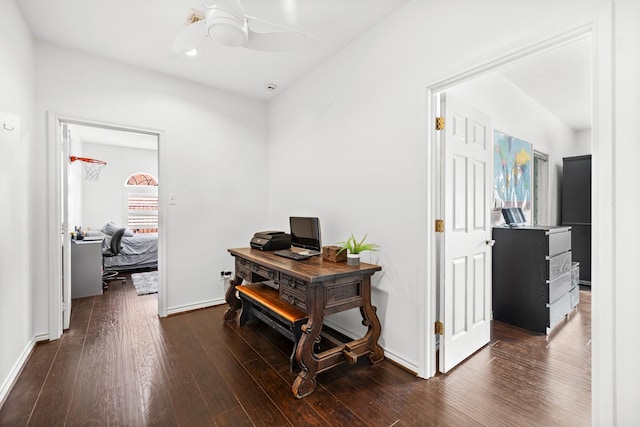 corridor with dark wood-type flooring, baseboards, and recessed lighting