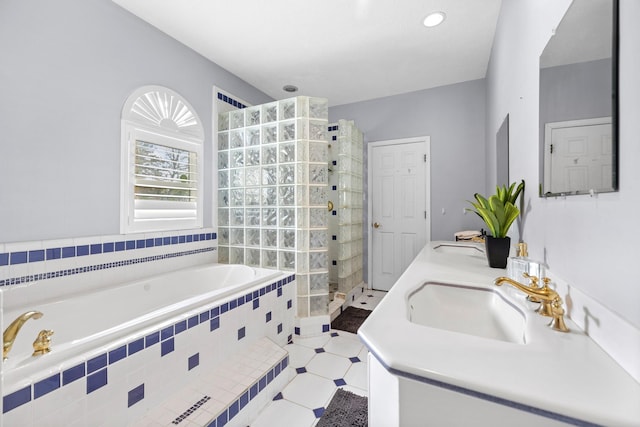 full bathroom with a bath, a sink, double vanity, and tiled shower