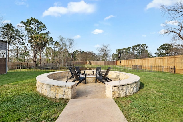 view of community with fence, a fire pit, and a yard