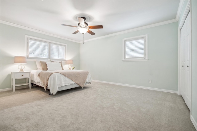 bedroom with crown molding, multiple windows, and carpet floors